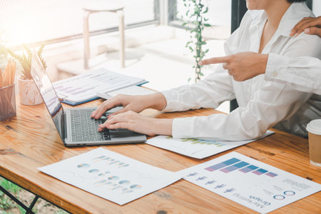 Business team analyzing income charts and graphs with modern laptop computer, Business concept.の写真素材