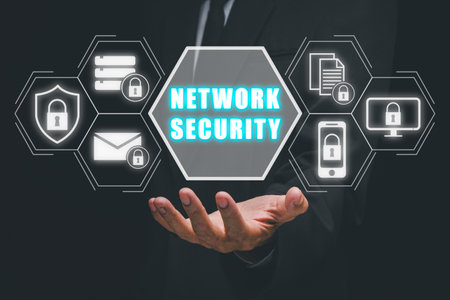 Network security concept, Businessman hand holding network security icon on virtual screen.の写真素材