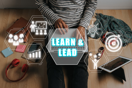 Learn and Lead concept, Person using laptop computer with Learn and Lead icon on vitual screen.の写真素材