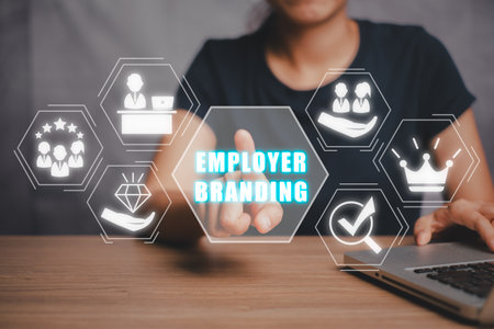 Employer branding concept, Person hand touching employer branding icon on virtual screen.の写真素材