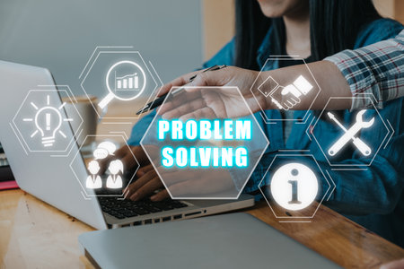 Problem solving concept, Business team working on laptop compuer on desk with problem solving icon on virtual screen.の写真素材