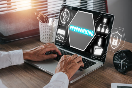 Programming concept, Person hand typing keyboard computer on desk workplace with programming icon on virtual screen.の写真素材