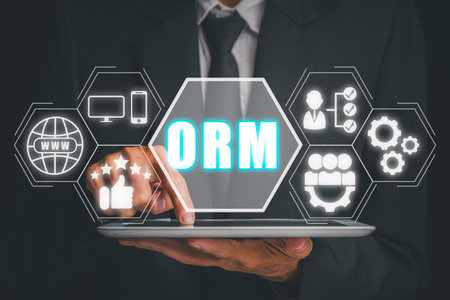 ORM, Online Reputation Management Optimization Business concept, Businessman using tablet with Online Reputation Management icon on virtual screen.の写真素材