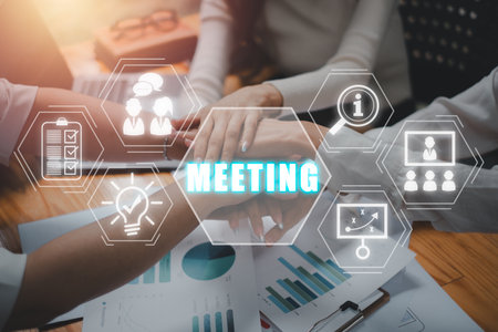 Meeting concept, Happy business team celebrating victory in office with meeting icon on virtual screen.の写真素材