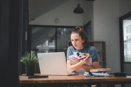 Business woman using business paper for doing math finance on office desk, tax, report, accounting, statistics, and analytical research conceptの写真素材