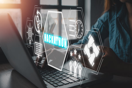 Hackathon concept, Business woman using laptop computer on office desk with hackathon icon on virtual screen.の写真素材