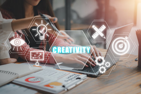 Creativity concept, Business team working on laptop computer with creativity icon on virtual screen.の写真素材