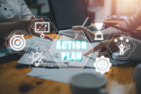 Action plan concept, Business team analyzing income charts and graphs on office desk with action plan icon on virtual screen.の写真素材