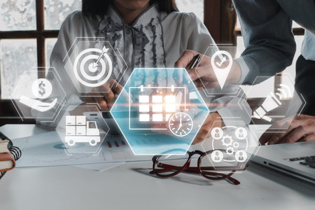 Business team planning and organizing events using modern technology and digital tools for...