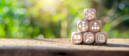 Wooden blocks with data mining icons on a natural background, symbolizing data analysis, storage, and network concepts.の写真素材