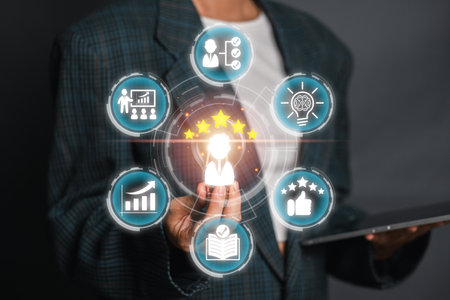 A business professional presenting a skills concept with icons symbolizing different competencies, achievements, and growth areas.の写真素材