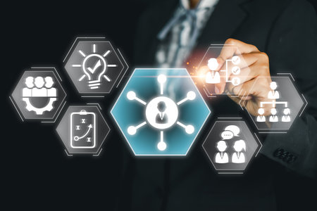 A business professional interacts with digital icons representing soft skills, emphasizing teamwork, communication, and leadership.の写真素材