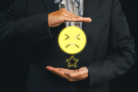 Illustration of negative feedback concept with a businessman holding a glowing sad face icon, symbolizing criticism and improvement.の写真素材