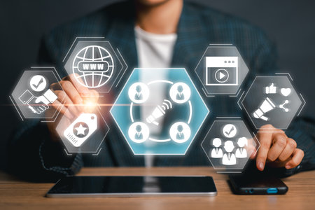 Business professional using digital interface for influencer marketing strategy with social media icons and network connections.の写真素材