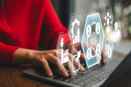 Futuristic digital interface showcasing outsourcing concept with business icons on a laptop,...