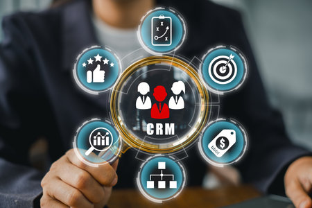 Business professional interacting with a CRM interface, showcasing customer relationship management and data analysis tools.の写真素材