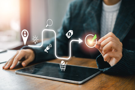 Illustration of a customer journey concept with digital icons and a business professional interacting with a tablet.の写真素材
