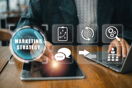 Business professional devising marketing strategy using digital tools and technology in a modern office setting.の写真素材