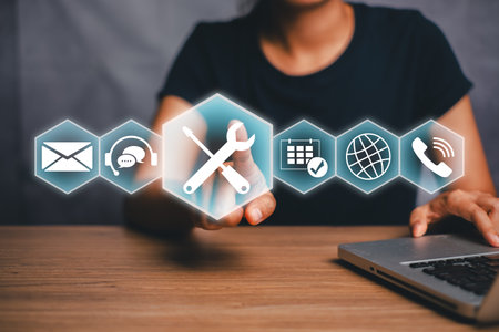 Woman using a virtual interface with digital tools and communication icons, symbolizing modern...