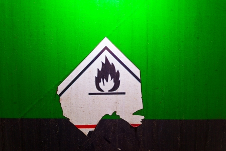 Fire danger symbol on a green texture railway carriageの写真素材