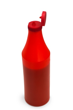 red plastic ketchup bottle isolated on whiteの写真素材