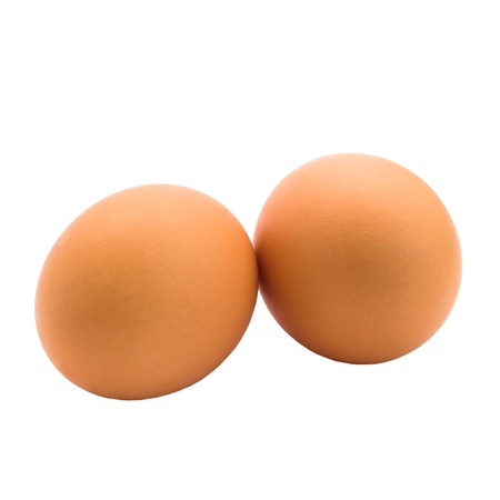 two eggs are isolated on white background (clipping path)の写真素材