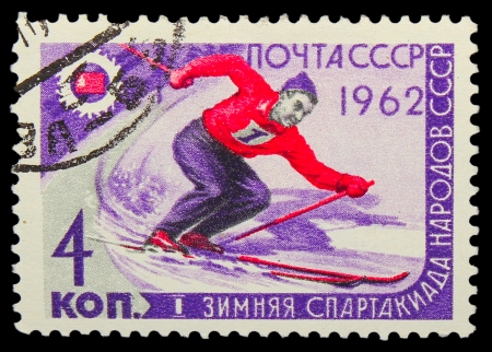 USSR - CIRCA 1962: A stamp printed in USSR,  first winter Games of the USSR, mountain slalom, skier, circa 1962のeditorial素材