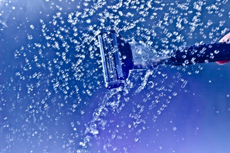 razor to shave in the blue water textureの写真素材