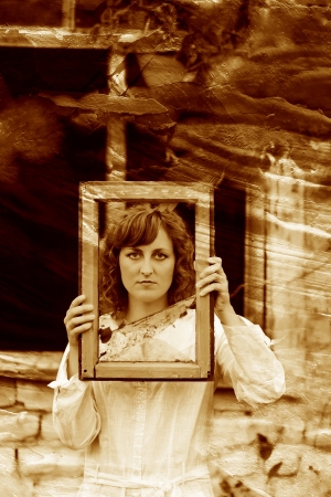 retro sepia photo European girl woman in white dress holding winの写真素材