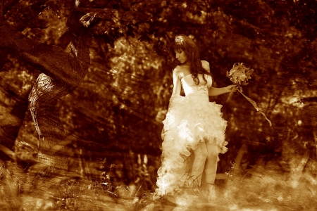 retro sepia photo, lonely woman in white dress at wedding brideの写真素材
