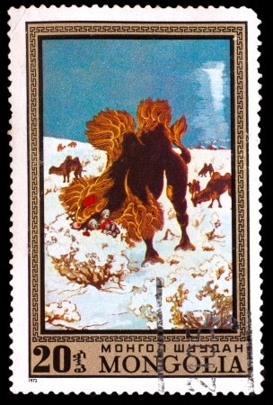 MONGOLIA - CIRCA 1972: A stamp printed by MONGOLIA , camel eats dry grass in winter, circa 1972の写真素材
