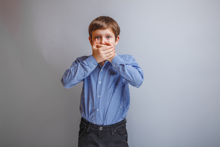 teenager boy 10 years of European appearance surprised closedの写真素材