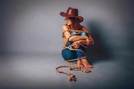 European appearance blonde girl with glasses in a cowboy hat isの写真素材