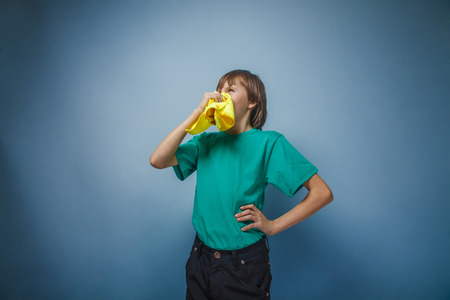 European-looking boy of ten years is ill, a handkerchief, a  runの写真素材