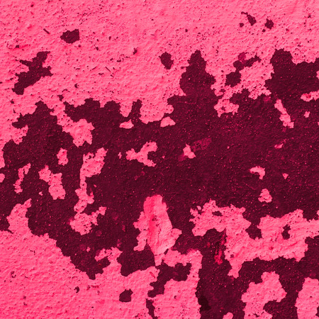 pink abstract texture old wall with cracks on the paintの写真素材