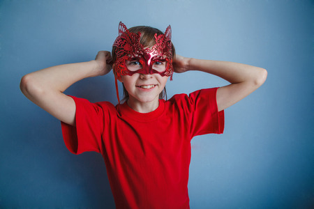 Boy teenager twelve years in the red shirt in the mask, super heroの写真素材