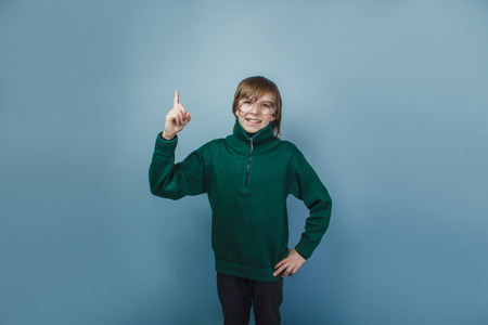 European-looking boy of ten years shows a finger の写真素材