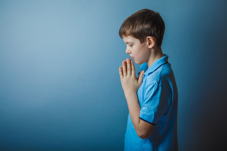 boy teenager European appearance in a blue shirt brown hair hungの写真素材