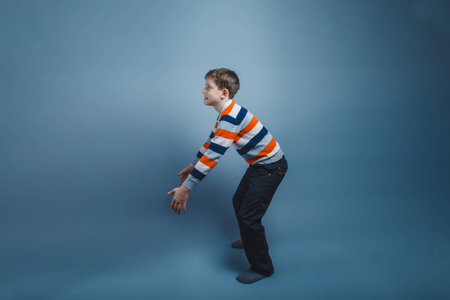 teenager boy standing European appearance on the floor stretchedの写真素材