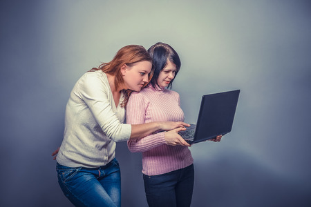Three girls European  appearance  girlfriend looking at a computの写真素材