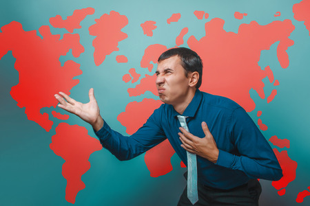 man male teacher Professor businessman showing on the United States a country disgusted anger irritation world map infographics studio backgroundの写真素材