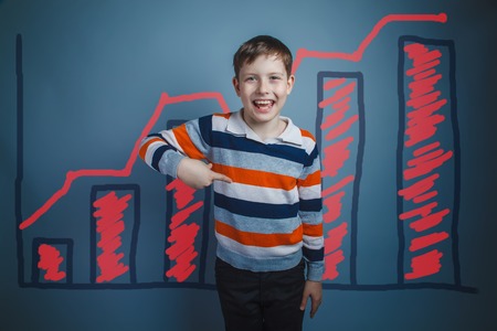 boy teenager European appearance Brown turned his back on a black backgroundの写真素材