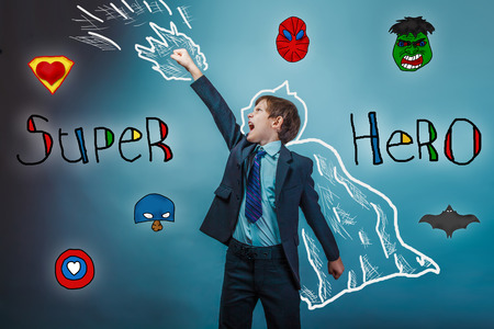 superhero boy raised his hands superpower  businessman flying photo behind cloak  studio teenagerの写真素材