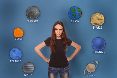 girl frowned angry hand on the body of the planet of the solar system astronomy
