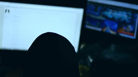 hacker man, trying to security breach search of computer system internetの写真素材