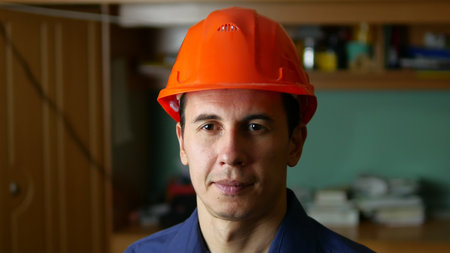 man construction worker in hard hat indoor portraitの写真素材