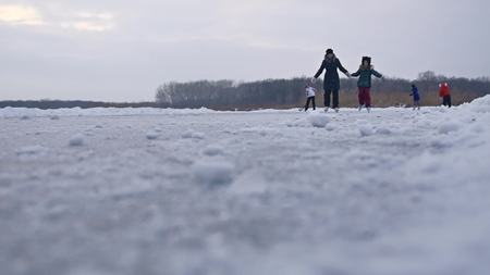 People skate on the skating rink in sports the winter on ice, active winter holiday familyの写真素材