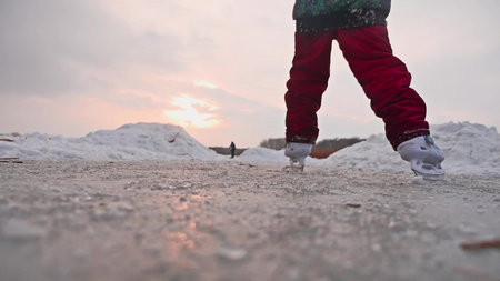 teen girl skating on ice, winter sunset beautiful view, winter holidaysの写真素材