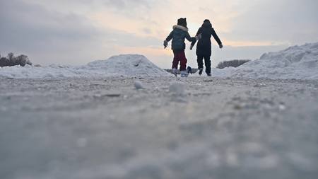 People skate on the skating rink in the winter on ice, active winter sports holiday familyの写真素材