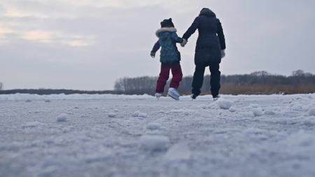 People skate on the skating rink in the winter on ice, active sports winter holiday familyの写真素材